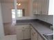 Well-lit kitchen featuring sleek countertops and classic cabinetry at 2459 Nw 55Th Avenue Rd, Ocala, FL 34482