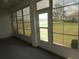 Enclosed lanai with neutral flooring and multiple windows overlooking the backyard at 2459 Nw 55Th Avenue Rd, Ocala, FL 34482