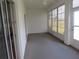 Enclosed lanai with neutral flooring and windows with views of the outdoor landscape at 2459 Nw 55Th Avenue Rd, Ocala, FL 34482