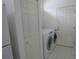 Laundry room with washer, dryer, storage closet, and white door at 2459 Nw 55Th Avenue Rd, Ocala, FL 34482