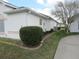 View of side yard showing manicured landscaping, rock borders, and the home's exterior at 2459 Nw 55Th Avenue Rd, Ocala, FL 34482