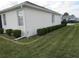 Well-maintained side yard featuring manicured landscaping and lush green lawn at 2459 Nw 55Th Avenue Rd, Ocala, FL 34482