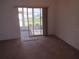 View of the tiled floor sun room with sliding glass door leading to the backyard at 2459 Nw 55Th Avenue Rd, Ocala, FL 34482