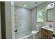 Beautiful bathroom showcasing a tiled shower, modern vanity, and natural light at 31 Juniper Pass Ln, Ocala, FL 34480