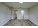 Bedroom featuring multiple doorways with new hard surface flooring and neutral paint at 31 Juniper Pass Ln, Ocala, FL 34480