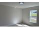 Cozy bedroom with a bright window and modern flooring for a comfortable ambiance at 31 Juniper Pass Ln, Ocala, FL 34480