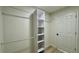 Walk-in closet with built in shelving and hanging rods at 31 Juniper Pass Ln, Ocala, FL 34480