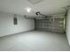 Spacious two car garage featuring a bright interior and automatic door opener at 31 Juniper Pass Ln, Ocala, FL 34480