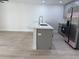 Kitchen island with stainless steel faucet and bar seating complements the stainless appliances at 31 Juniper Pass Ln, Ocala, FL 34480