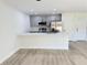 Modern kitchen with stainless steel appliances, quartz countertops, and ample cabinet space at 31 Juniper Pass Ln, Ocala, FL 34480