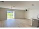 Open-concept living space with ample natural light and sliding glass door to backyard at 31 Juniper Pass Ln, Ocala, FL 34480