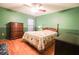 Bright bedroom with hardwood floors, a ceiling fan and traditional furnishings at 3447 Sw 19Th Pl, Ocala, FL 34474