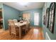 Cozy dining room with hardwood floors, a stylish table, and decorative accents at 3447 Sw 19Th Pl, Ocala, FL 34474