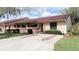 Charming single-story home with a well-manicured front yard and a spacious driveway at 3447 Sw 19Th Pl, Ocala, FL 34474