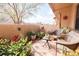 Enclosed patio has lounge furniture, flowers and shrubbery at 3447 Sw 19Th Pl, Ocala, FL 34474