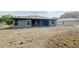 Back exterior of a home, with a covered patio overlooking the yard at 4059 Sw 131St Place Rd, Ocala, FL 34473