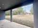 View from the covered patio to the large, unfinished backyard at 4059 Sw 131St Place Rd, Ocala, FL 34473