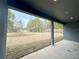 Covered patio looking out onto a large, unfinished backyard at 4059 Sw 131St Place Rd, Ocala, FL 34473