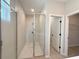 Bathroom features a tiled shower with glass door at 4059 Sw 131St Place Rd, Ocala, FL 34473