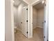 Bathroom with toilet and doorway to walk-in closet at 4059 Sw 131St Place Rd, Ocala, FL 34473