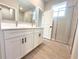 Bathroom with double sink vanity, walk-in closet, and walk-in shower at 4059 Sw 131St Place Rd, Ocala, FL 34473