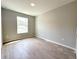 A cozy bedroom featuring tile floors and a window that offers natural light at 4059 Sw 131St Place Rd, Ocala, FL 34473