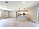 Open-concept living area showcasing tile floors, neutral walls, recessed lighting, and modern kitchen at 4059 Sw 131St Place Rd, Ocala, FL 34473
