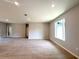 Bright, open-concept living area boasts neutral walls, tile floors, recessed lighting, and natural light at 4059 Sw 131St Place Rd, Ocala, FL 34473