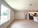 Bright, open-concept living area boasts neutral walls, tile floors, recessed lighting, and kitchen access at 4059 Sw 131St Place Rd, Ocala, FL 34473