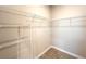 Walk-in closet featuring wire shelving and wood-look tile flooring at 4059 Sw 131St Place Rd, Ocala, FL 34473
