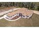 New home with a well-manicured lawn, complemented by the surrounding greenery, showcases its inviting exterior at 4869 Nw 101St Street Rd, Ocala, FL 34482