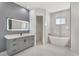 Modern bathroom with a soaking tub, vanity, and stylish fixtures at 4869 Nw 101St Street Rd, Ocala, FL 34482
