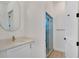 Bright bathroom with vanity, granite countertop and modern glass shower with brushed gold fixtures at 4869 Nw 101St Street Rd, Ocala, FL 34482