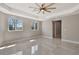 Bright bedroom featuring tile floors, a ceiling fan, recessed lighting, and windows with green views at 4869 Nw 101St Street Rd, Ocala, FL 34482
