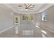 Bright bedroom featuring tile floors, a ceiling fan, recessed lighting, and windows with green views at 4869 Nw 101St Street Rd, Ocala, FL 34482