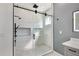 Contemporary walk-in shower with dual shower heads and a sleek sliding glass door at 4869 Nw 101St Street Rd, Ocala, FL 34482
