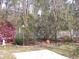 Landscaped backyard with a white picket fence and decorative elements at 5181 Sw 164Th Street Rd, Ocala, FL 34473