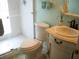 Bright bathroom featuring a glass-enclosed shower, toilet, and a vanity with a white cabinet and marble countertop at 5181 Sw 164Th Street Rd, Ocala, FL 34473