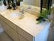 Bathroom vanity with a white countertop, decorative accents, and ample storage space, blending style with practical features at 5181 Sw 164Th Street Rd, Ocala, FL 34473