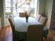 Bright dining room area featuring a large bay window and seating for six at 5181 Sw 164Th Street Rd, Ocala, FL 34473
