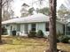 Exterior shot showcasing a well-maintained home with a tidy lawn at 5181 Sw 164Th Street Rd, Ocala, FL 34473