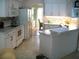 Spacious kitchen features white appliances and modern style white cabinetry at 5181 Sw 164Th Street Rd, Ocala, FL 34473