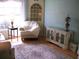 Living room with lots of natural light, hard wood flooring and a decorative rug at 5181 Sw 164Th Street Rd, Ocala, FL 34473