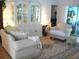 Cozy living room with elegant furniture, showcasing a stylish hutch and providing access to the outdoor lanai at 5181 Sw 164Th Street Rd, Ocala, FL 34473