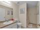 Neutral bathroom featuring a single vanity with tile flooring and shower with patterned curtain at 5758 Nw 63Rd Pl, Ocala, FL 34482