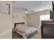 Comfortable bedroom with soft carpet, ceiling fan, and lots of natural light at 5758 Nw 63Rd Pl, Ocala, FL 34482