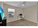 Bedroom with neutral carpet and a bright, airy feel, ideal for a home office at 5758 Nw 63Rd Pl, Ocala, FL 34482