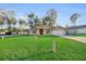 Beautiful single-story home with well-manicured lawn, lush grass and long driveway at 5758 Nw 63Rd Pl, Ocala, FL 34482