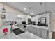 Stylish kitchen with white cabinets, marble countertops, and modern stainless steel appliances at 5758 Nw 63Rd Pl, Ocala, FL 34482
