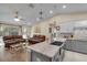 Spacious kitchen with center island that seamlessly connects with the adjacent living room at 5758 Nw 63Rd Pl, Ocala, FL 34482